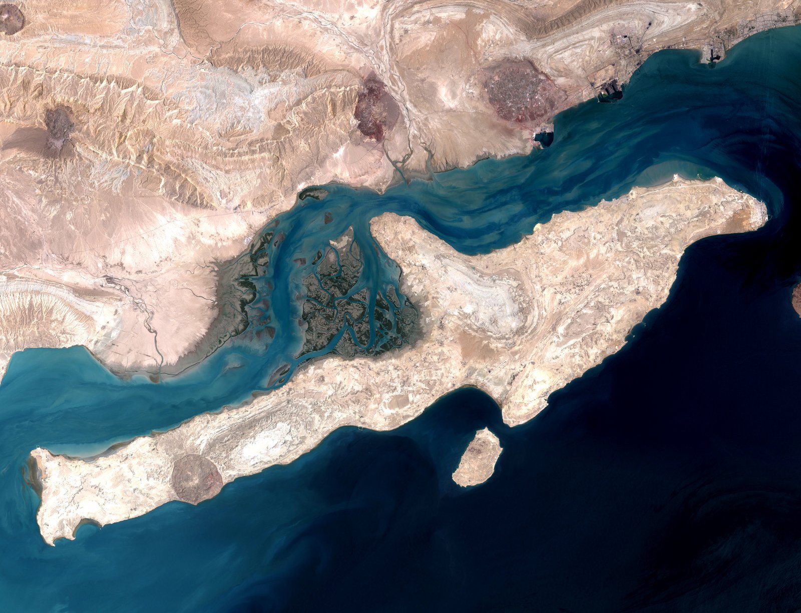 Archival NASA Landsat 7 satellite view of Qeshm Island in the Strait of Hormuz. Region plate only — not overnight blast imagery.