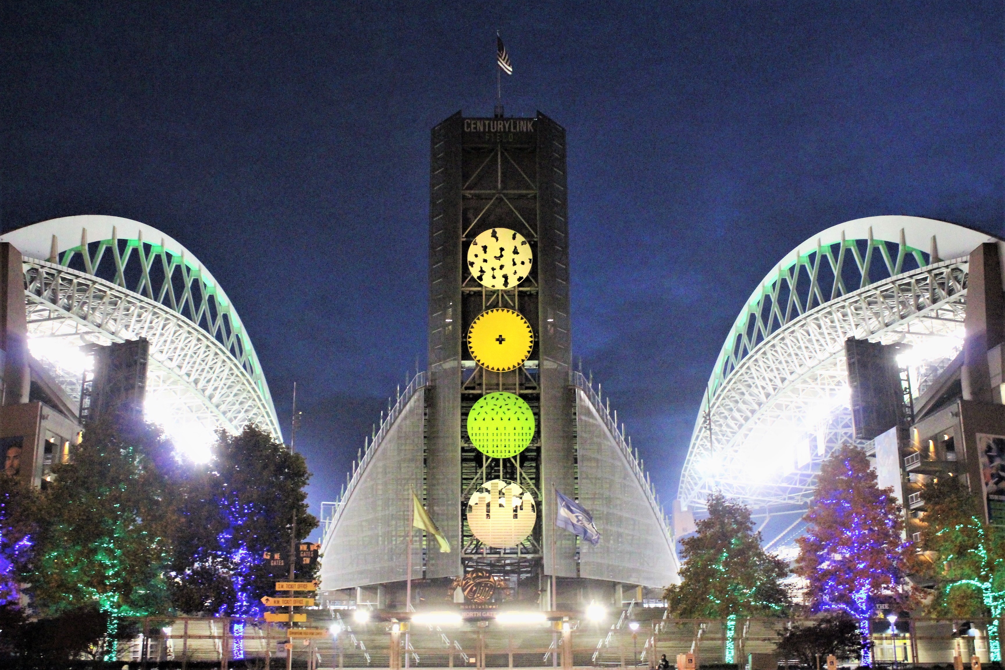 Lumen Field night exterior — archival venue still by Richardmouser. Not Kickoff game action. Official Seahawks and Patriots crests used for identification only.